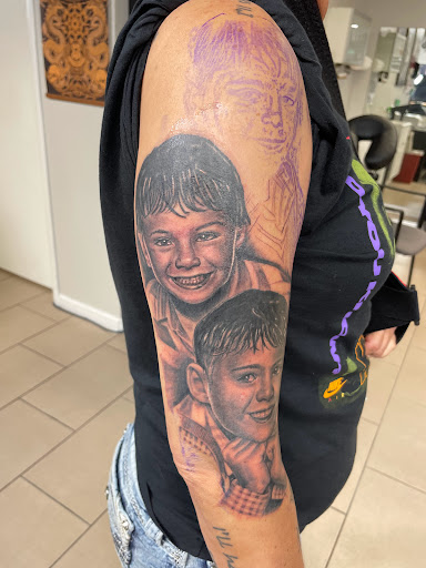 Explore women's thigh tattoo ideas, creative tattoo ideas in Sarasota, available at SEVEN SINS Tattoo Studio