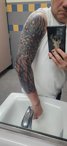 Explore gangster tattoo ideas for men, creative tattoo ideas in Angola, available at Hoodlum Ink