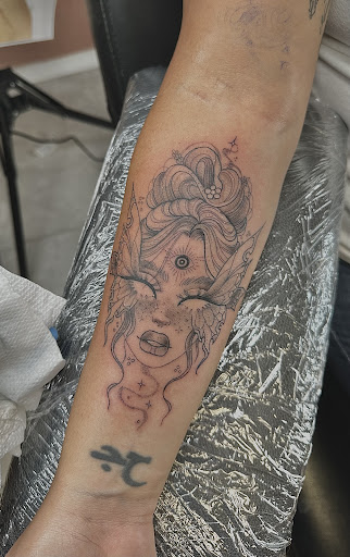 Explore wolf tattoo ideas for men, creative tattoo ideas in Zephyrhills, available at The Tattoo Haven