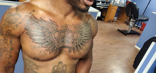 Explore female tattoo ideas for lower back, creative tattoo ideas in Tupelo, available at Primal Ink Tattoo Studio