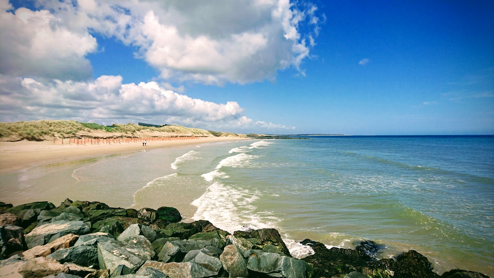 Foto von Rosslare Beach mit heller sand Oberfläche