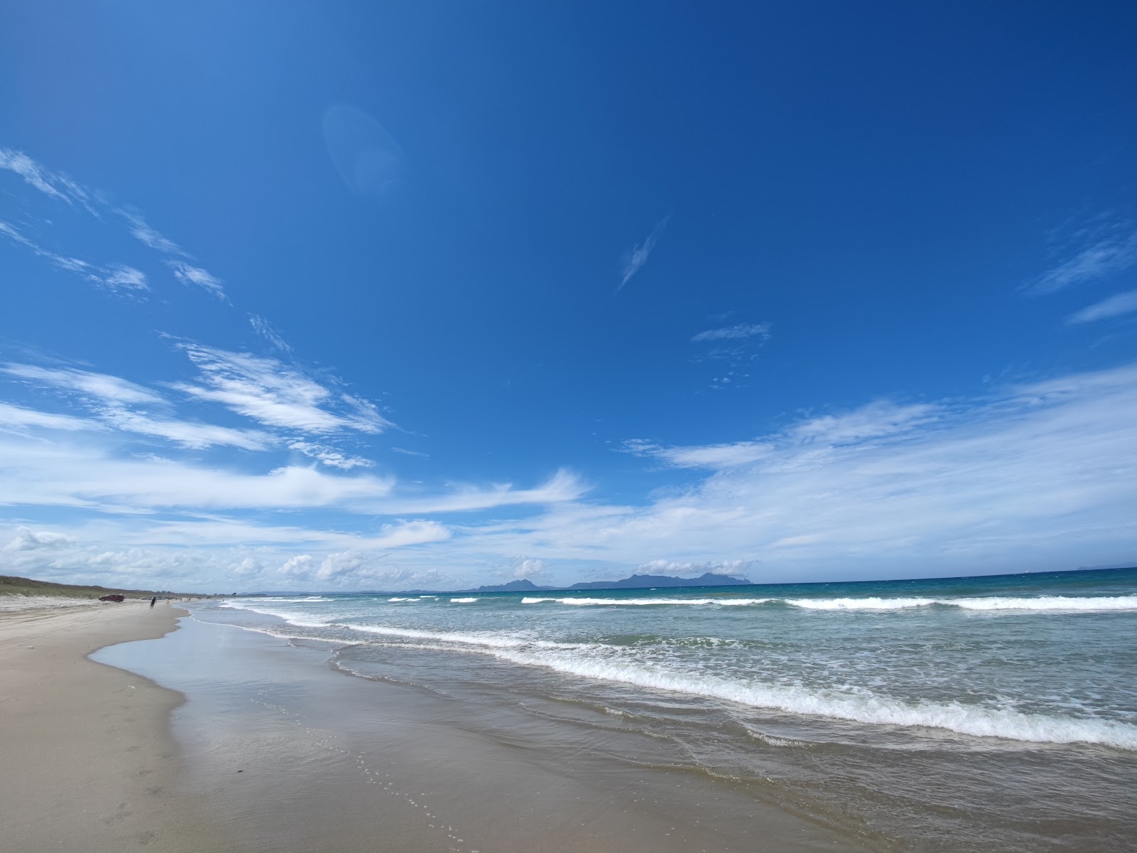 Foto van Uretiti Beach met helder zand oppervlakte