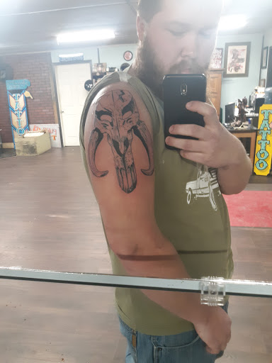 Explore campfire tattoo ideas, creative tattoo ideas in Riverton, available at Pure Quill Tattoo