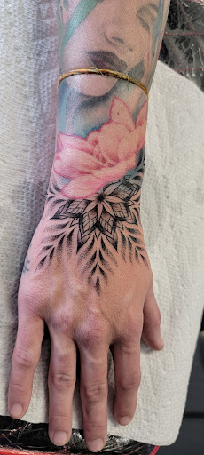 Find dragon arm tattoo ideas for your next unique tattoo in Kalispell at Swindler Ink