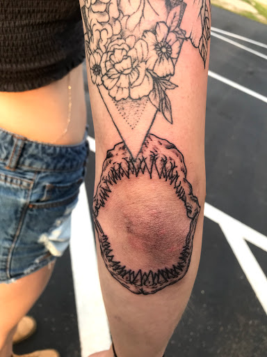 Explore black bear tattoo ideas, creative tattoo ideas in Muncie, available at The Tattoo Studio