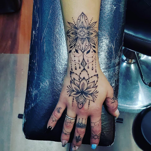 Explore fine line hand tattoo ideas, creative tattoo ideas in Colorado Springs, available at Skin Evolution Tattoo