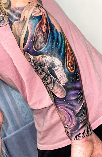 Explore women's arm sleeve tattoo ideas, creative tattoo ideas in Sarasota, available at SEVEN SINS Tattoo Studio