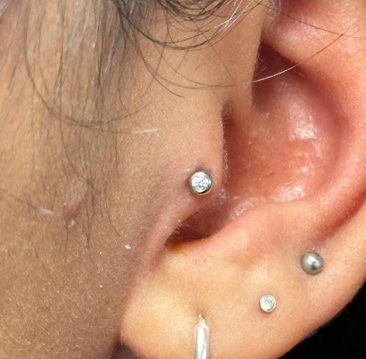 Explore ear tattoos ideas, creative tattoo ideas in Abington, available at Ink Boss Tattoo & Piercing Studio