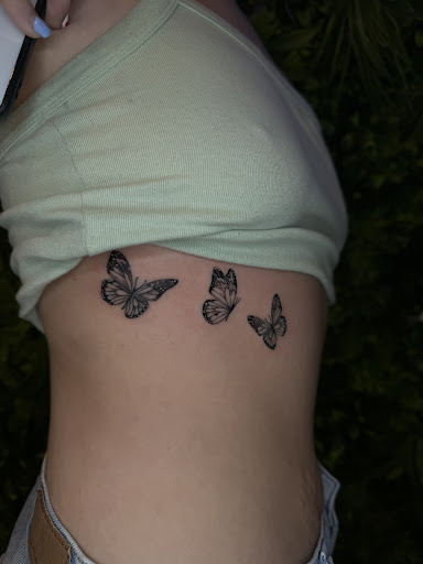 Explore dog tattoo ideas for guys, creative tattoo ideas in Davenport, available at Fine Ink Studios Tattoos