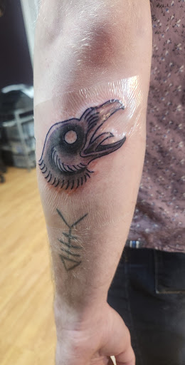 Explore middle neck tattoo ideas, creative tattoo ideas in Hopkinsville, available at FNT Tattoo & Piercings