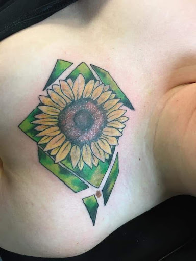 Explore electric guitar tattoo ideas, creative tattoo ideas in Osceola, available at Crowned Raven Tattoo Inc.