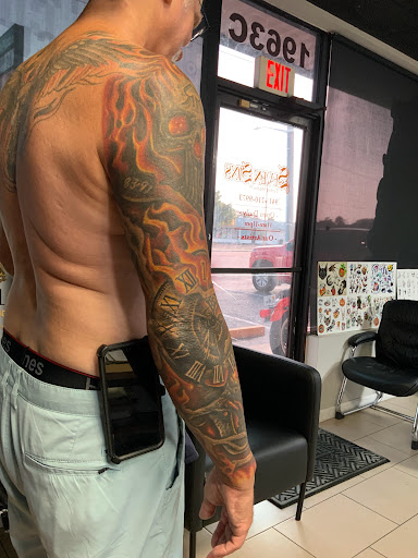 Explore tattoo ideas behind the ear, creative tattoo ideas in Sarasota, available at SEVEN SINS Tattoo Studio