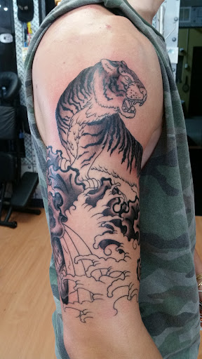 Explore tiny hummingbird tattoo ideas, creative tattoo ideas in Puyallup, available at The Tattoo Shop