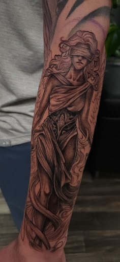 Explore book dragon tattoo ideas, creative tattoo ideas in Anchorage, available at SDITATTOO, LLC