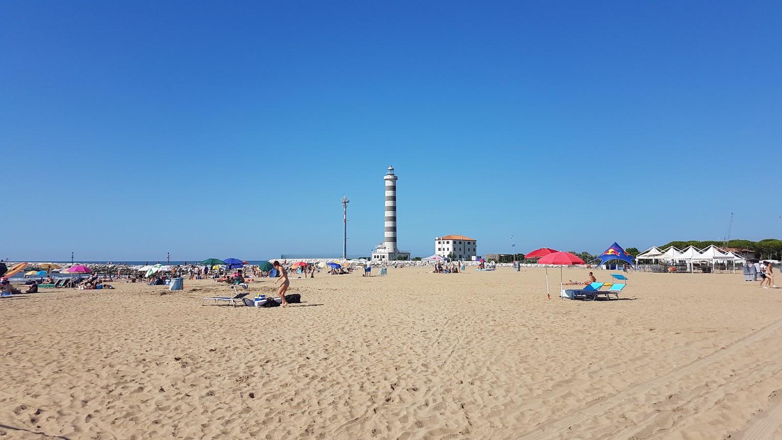 Zdjęcie Spiaggia del Faro z powierzchnią turkusowa czysta woda