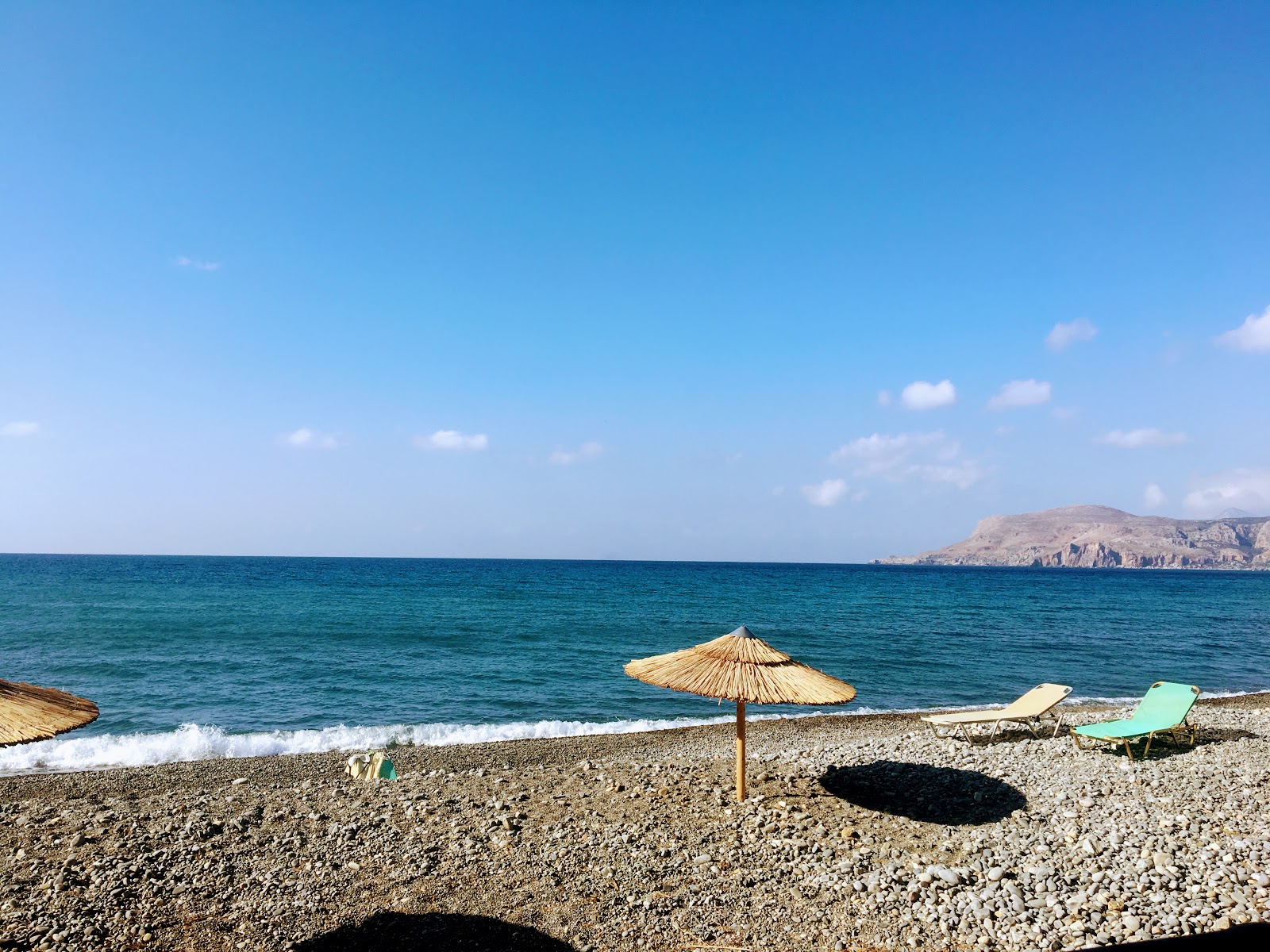 Φωτογραφία του Sfinari Beach - δημοφιλές μέρος μεταξύ λάτρεις της χαλάρωσης