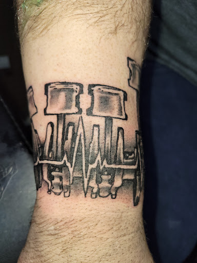 Explore navel tattoo ideas, creative tattoo ideas in Angola, available at Hoodlum Ink