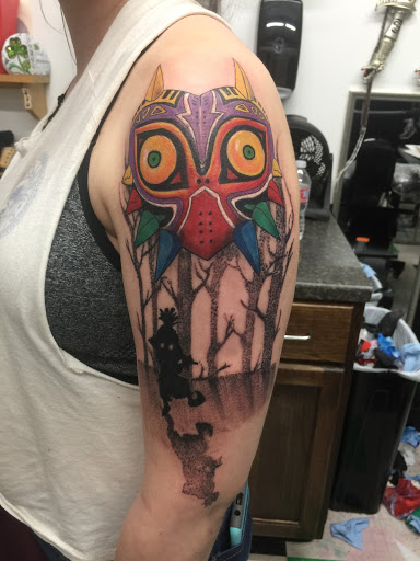 Explore upper arm cover up tattoo ideas, creative tattoo ideas in Lawton, available at Impact Ink Tattoo Studios