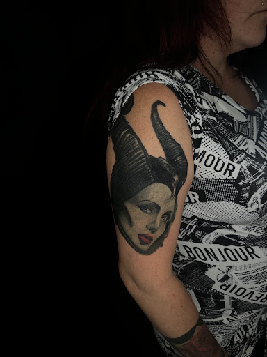 Explore pulp fiction tattoo ideas, creative tattoo ideas in Titusville, available at Space Coast Ink Tattoo Studio