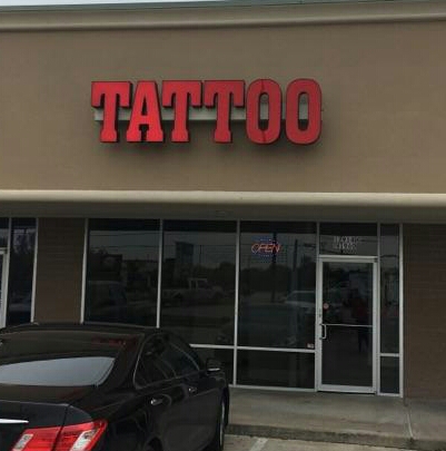 Explore dog tag tattoo ideas, creative tattoo ideas in Houston, available at Rose & Dagger Tattoo
