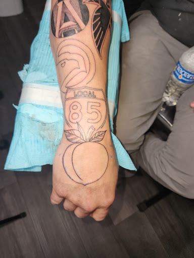 Explore family flower tattoo ideas, creative tattoo ideas in Lawrenceville, available at Saints and Sinners Atl