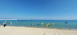 Hupo Beach'in fotoğrafı geniş bir kıyı şeridi ile birlikte