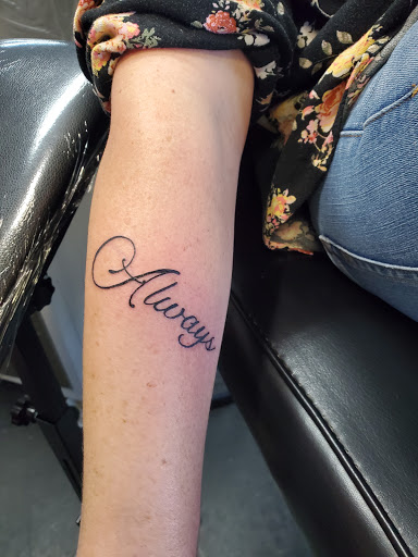 Explore anime forearm tattoo ideas, creative tattoo ideas in Hilliard, available at 22 Caliber Tattoo Mega Studio