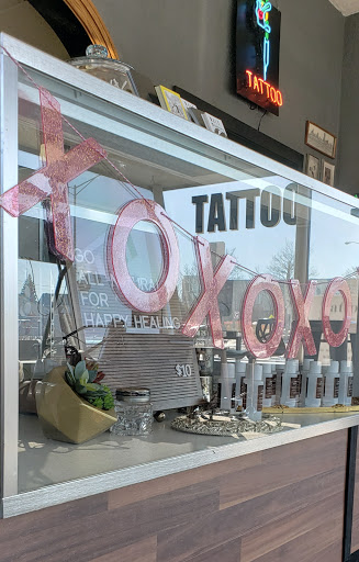 Explore money tattoos ideas, creative tattoo ideas in Milwaukee, available at Bay Street Tattoo Co.