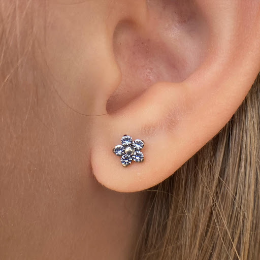 Explore sternum tattoo ideas for females, creative tattoo ideas in Dover, available at Agap Body Piercings