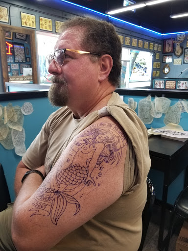 Explore tattoo ideas for men bicep, creative tattoo ideas in Lockhart, available at Electric Rodeo Tattoo