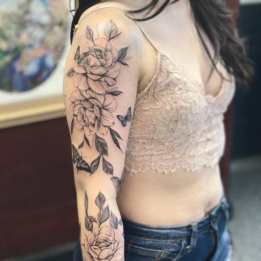 Explore rose tattoo ideas for females, creative tattoo ideas in Cambridge, available at Hidden Vibes Tattoo