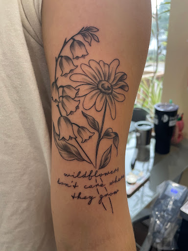 Explore flower leg tattoo ideas, creative tattoo ideas in Richmond, available at Loose Screw Tattoo