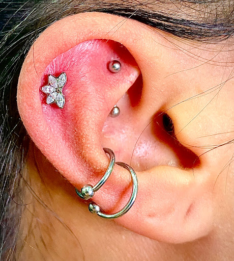 Explore weird tattoo ideas, creative tattoo ideas in Orange, available at Symbiosis Body Piercing