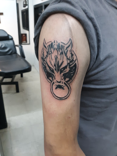 Explore bicep tattoo ideas for men, creative tattoo ideas in San Angelo, available at Alchemy Tattoo and Piercing Studio