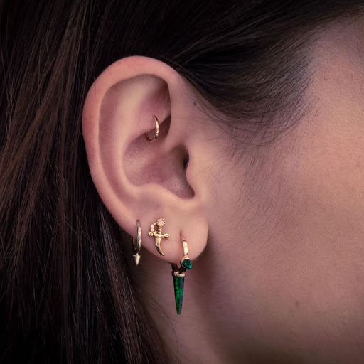 Explore the 1975 tattoo ideas, creative tattoo ideas in New York, available at MARIA TASH Fine Jewelry & Luxury Piercing