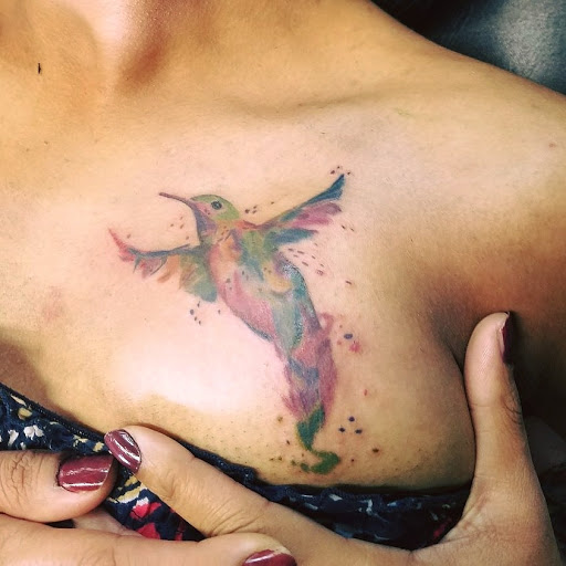 Explore afro tattoo ideas, creative tattoo ideas in Mebane, available at The Cardinal Skin Art & Gallery