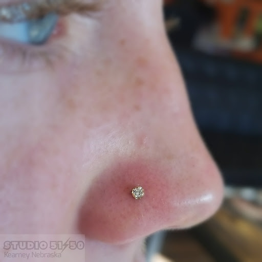 Explore surreal tattoo ideas, creative tattoo ideas in Kearney, available at Studio 5150 Piercing & Fine Jewelry