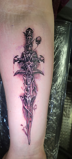 Explore marriage ring tattoo ideas, creative tattoo ideas in Angola, available at Hoodlum Ink