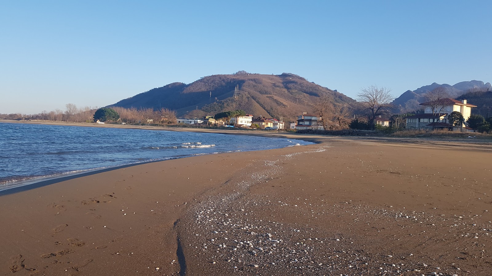 Foto di Gulyali Beach con una superficie del sabbia beige