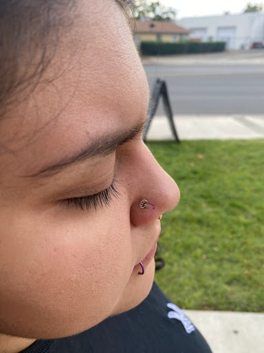 Explore color flower tattoo ideas, creative tattoo ideas in Visalia, available at La Luna Piercings and Fine Jewelry