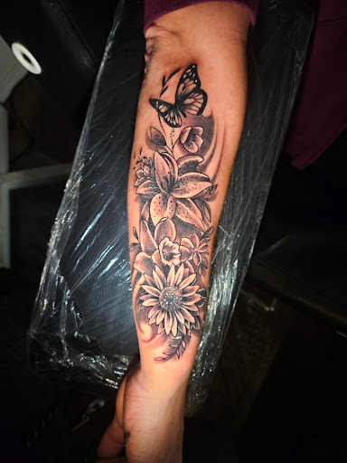 Explore tattoo sleeves ideas design, creative tattoo ideas in Angola, available at Hoodlum Ink