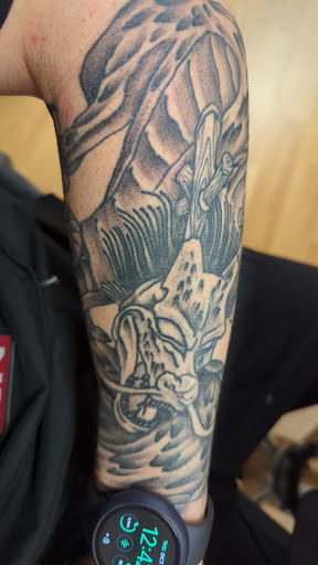 Explore black bear tattoo ideas, creative tattoo ideas in Milwaukee, available at Mike Davenport Tattoo