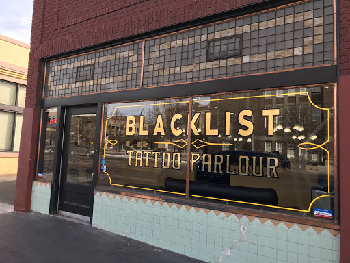 Find inbetween boob tattoo ideas for your next unique tattoo in Albuquerque at Blacklist Tattoo Parlour Tattoo Shop in Albuquerque