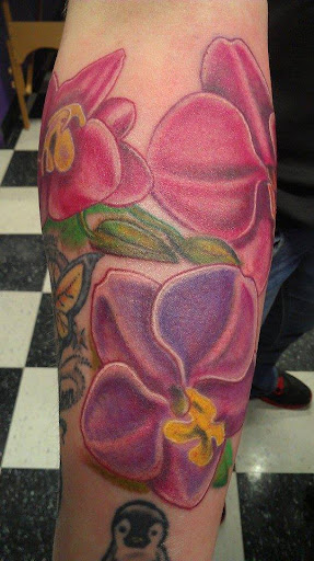 Explore world tattoo ideas, creative tattoo ideas in Wooster, available at Iron Rose Tattoo Company