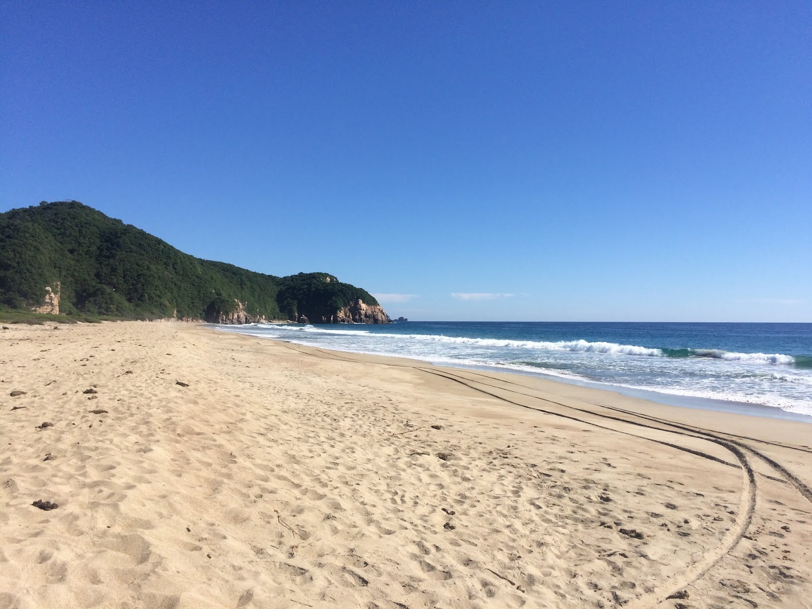 Foto di Playa el Coco con una superficie del acqua cristallina