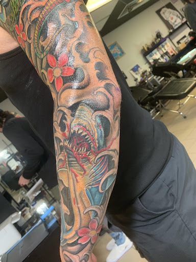 Explore arrow tattoo ideas for men, creative tattoo ideas in Sarasota, available at SEVEN SINS Tattoo Studio