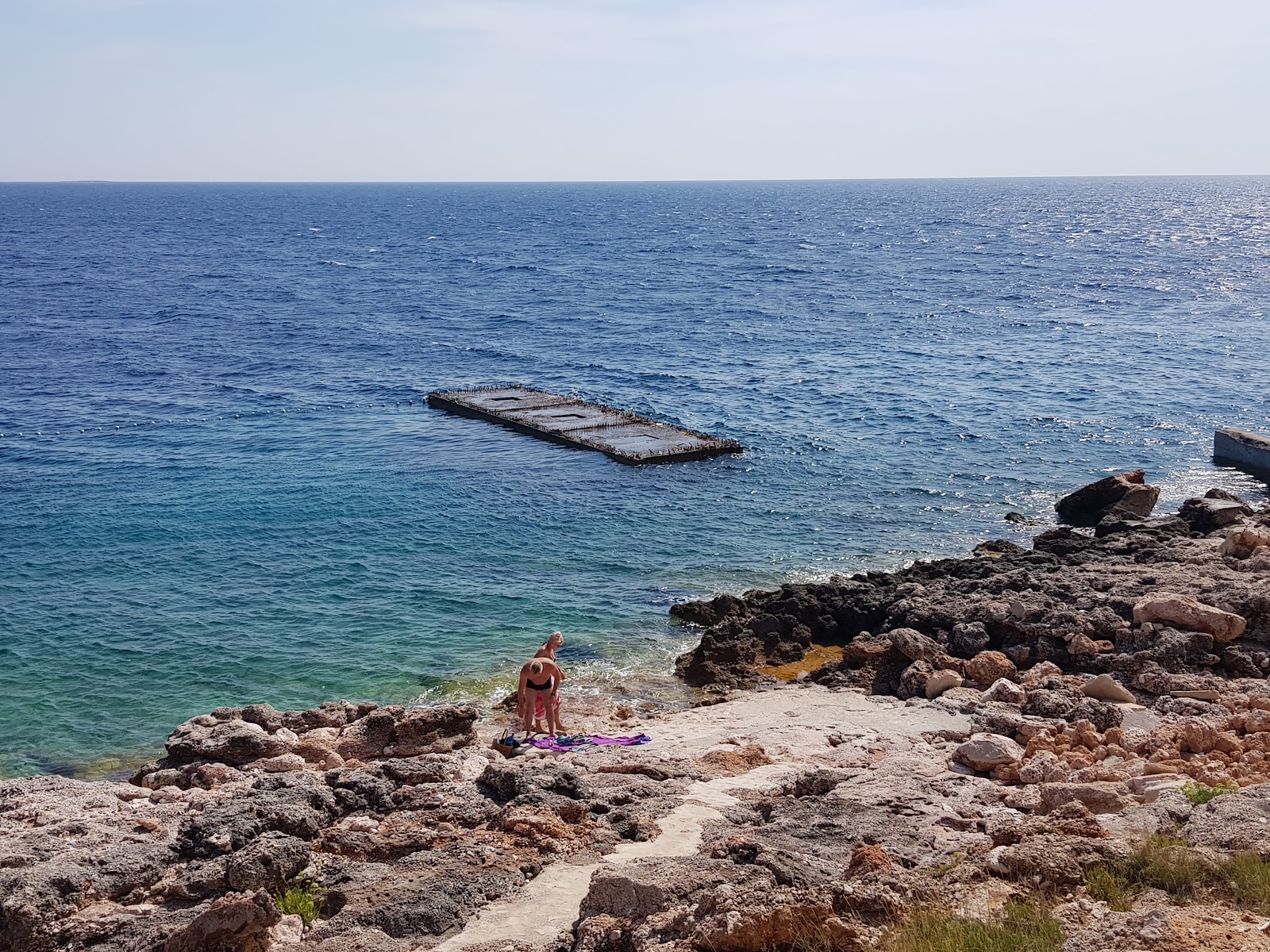 Foto von Sveta Nedjelja beach mit felsiges gelände Oberfläche