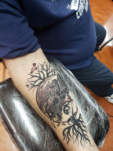 Explore gay couple tattoo ideas, creative tattoo ideas in Coeur D Alene, available at Jojos Tattoo & Body Piercing
