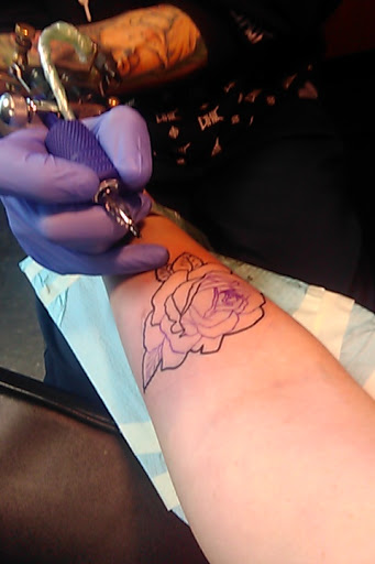 Explore nike tattoo ideas, creative tattoo ideas in Fort Collins, available at Rocksteady Tattoo