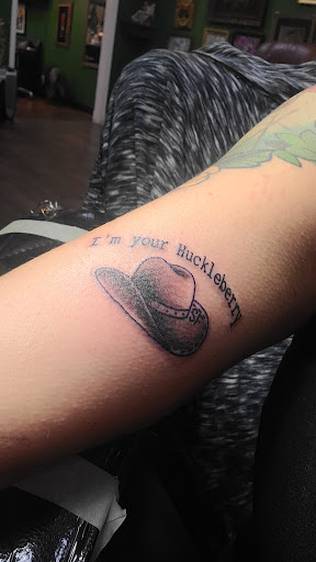 Explore afro tattoo ideas, creative tattoo ideas in Riverside, available at The Madd Tatterz Tattoo Parlor